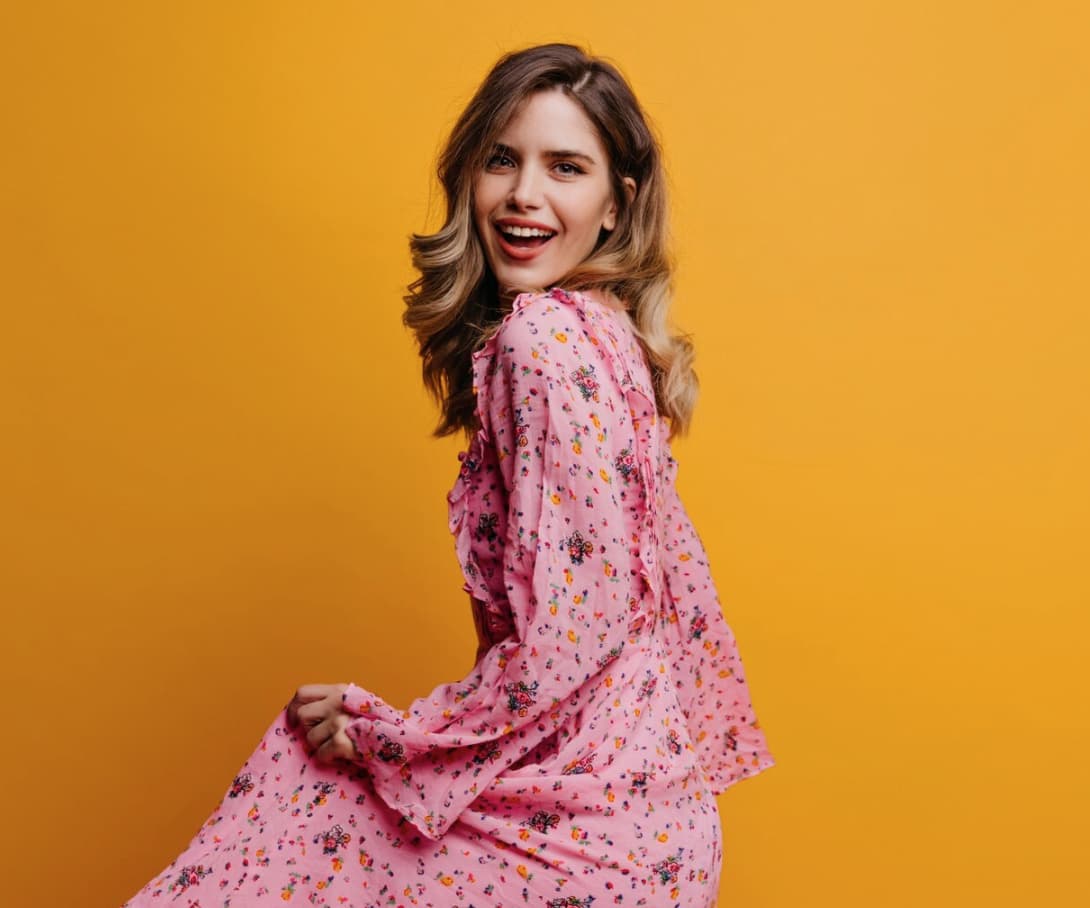 Model in pink floral dress